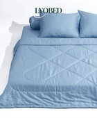 LYOBED duvet cover in soft blue color, featuring breathable Tencel™ fabric for comfort and skin-friendly sleep.